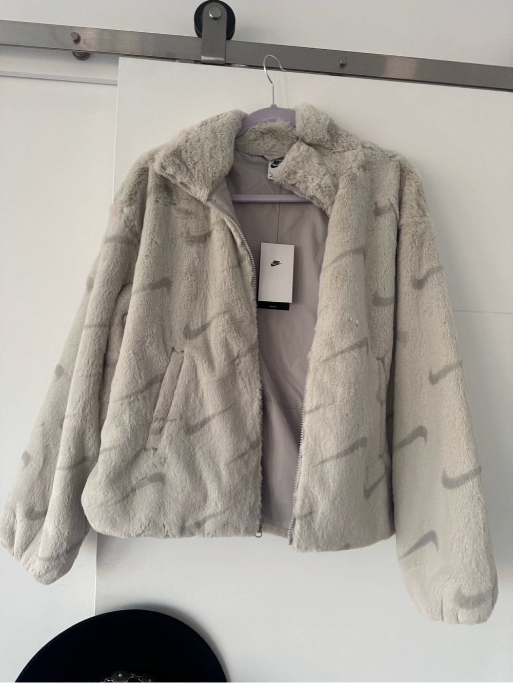 Nike Women's Light Gray Faux Fur Zip-Up Jacket with Subtle Swoosh Pattern